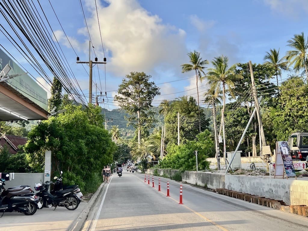 Sairee Street where you can walk to the beach road to find the local Thai foods
